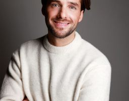 NICOLAS S.